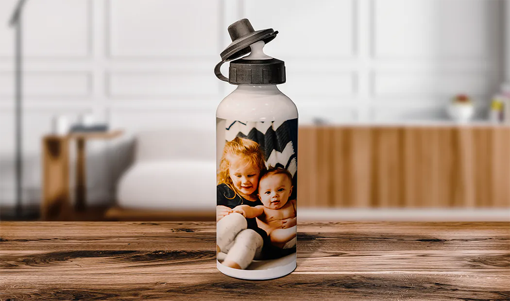 Personalised water bottle; white, featuring a child's photo, black flip-top lid. Unique gift!