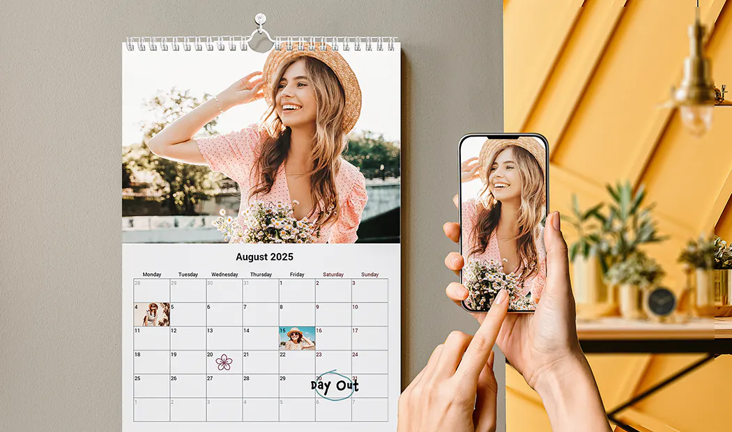 Romantic couple in living room with personalised 2020 wall calendar with proposal photo